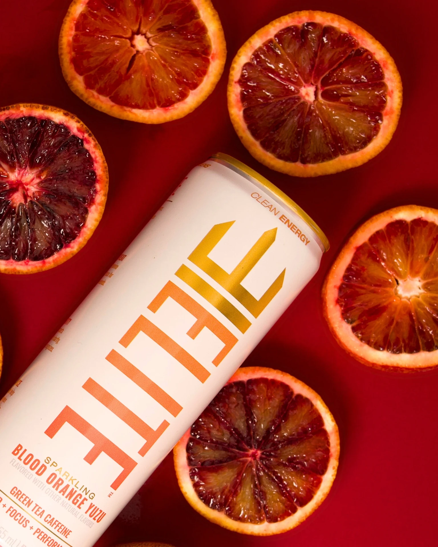 ELITE Blood Orange Yuzu can surrounded by fresh blood orange slices